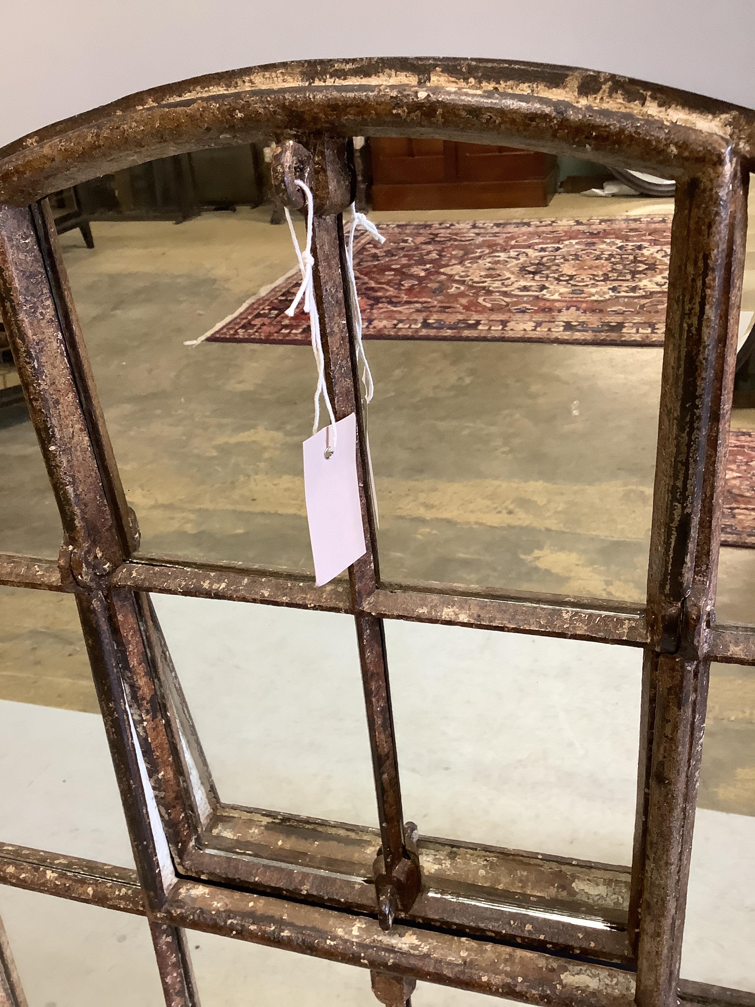 An industrial style cast iron arched window wall mirror, width 92cm, height 115cm